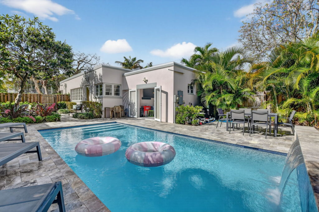 Private pool and tropical backyard at Pink Palm Retreat, a vacation rental in Delray Beach, Florida