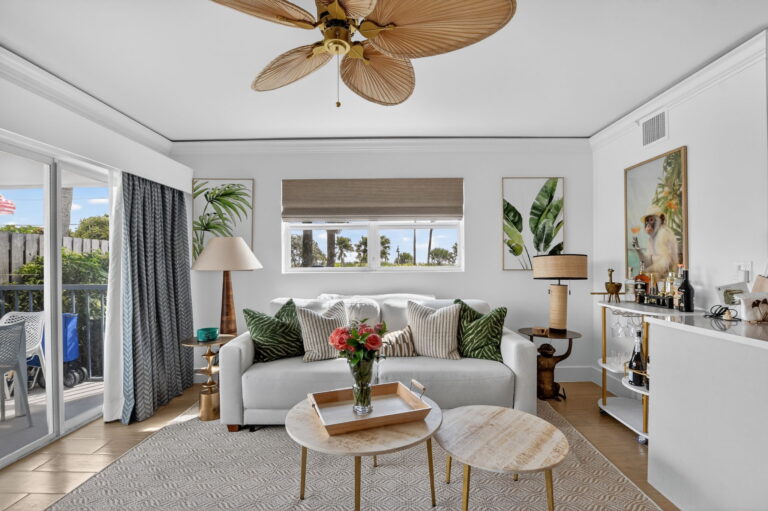 Bright living room with tropical decor at Delray Cabana Condo, an oceanfront vacation rental in Delray Beach, Florida.
