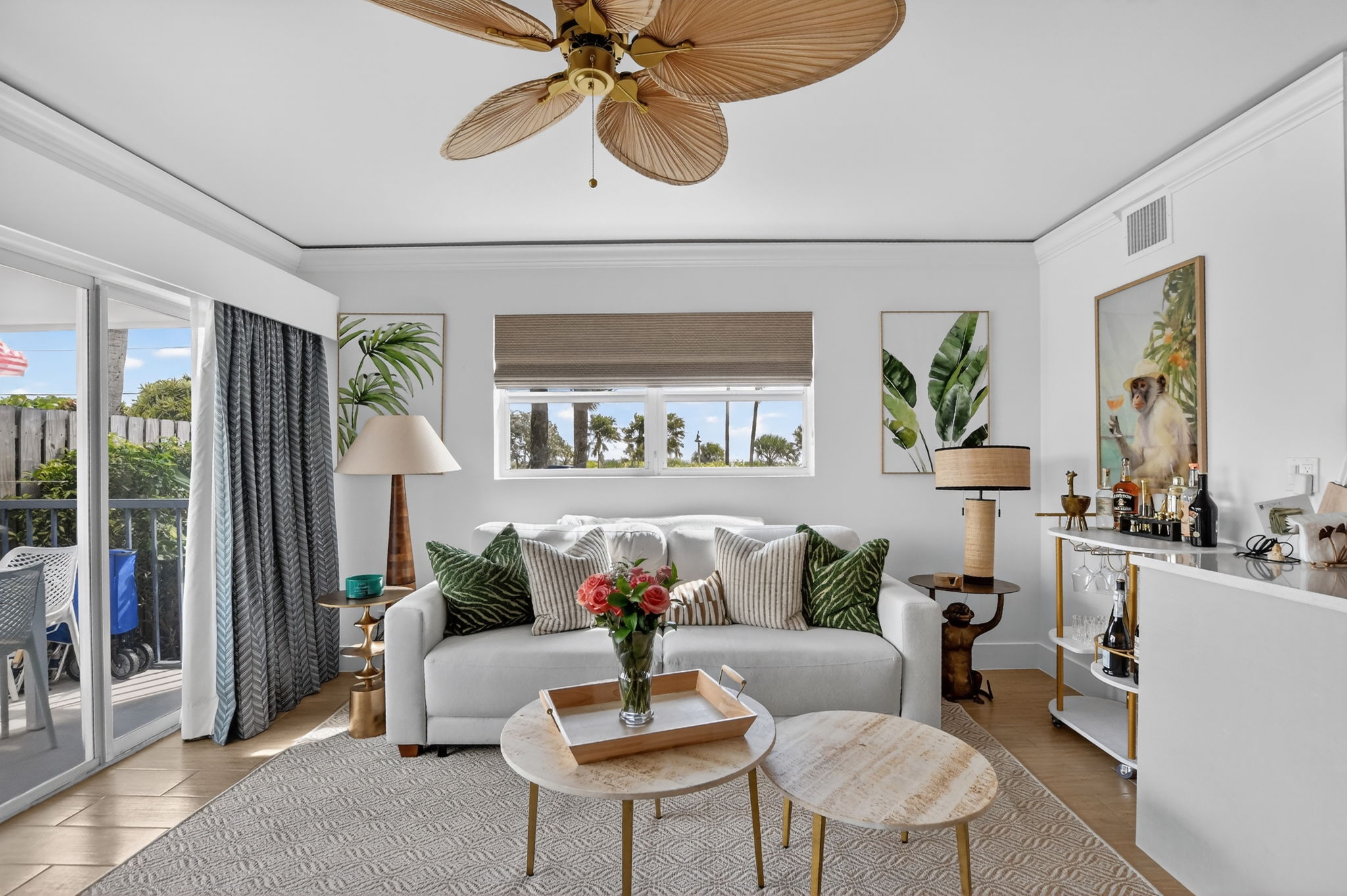 Bright tropical living room with patio doors